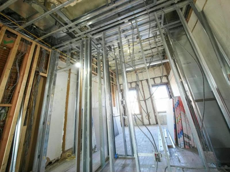 Steel stud framing and electrical rough-in during an interior renovation